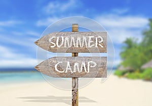 Wooden direction sign with summer camp