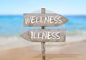 Wooden direction sign with wellness and illness