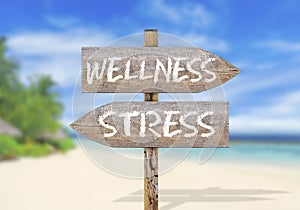 Wooden direction sign with wellness and stress