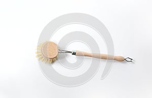 Wooden dish brush with bamboo wood and natural Bristle Tampico Fiber, on white background . Item for cleaning in kitchen