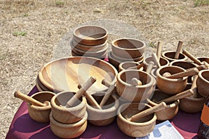 Wooden the dish and is a lot of wooden mortars