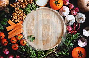 Wooden dish surrounding with fresh healthy food ingredient