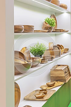 Wooden dishes. Kitchen utensils and accessories made of bamboo. Eco-friendly products. Various salad bowls, dishes, plates, food