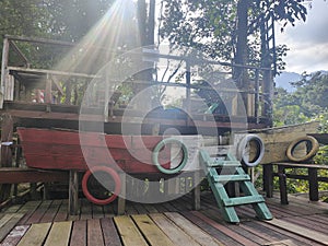 Wooden Display Boat Basked in Sunlight