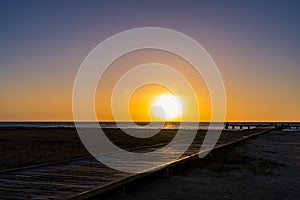 Wooden dock  with beautiful sunset at the background. Coche Island, Venezuela