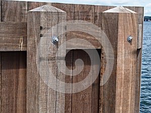 Wooden dock breakwall in a marina harbor