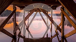 A wooden dock extends over Lake Dow.