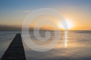 Wooden dock at the Gulf of Cariaco at sunset.