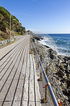 Wooden dock over the cliffs by the sea in Varazze, Italy