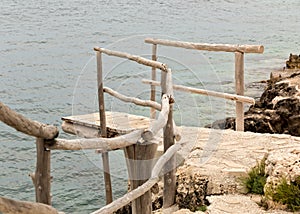 Wooden dock at a seaside cliff