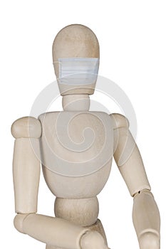 wooden doll in a medical mask
