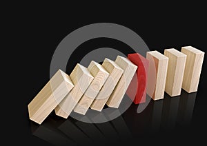 Wooden domino blocks falling down in sequence, one piece stopping the fall