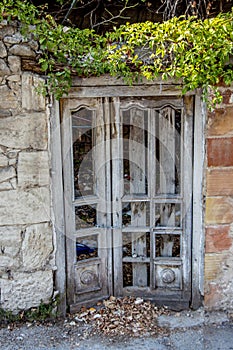 Wooden door of an abandoned house