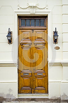 Wooden door and antique luminaires