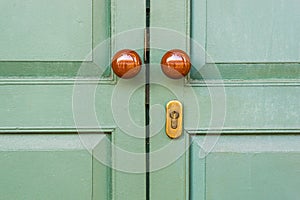 Wooden door with brown knobs