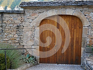 Wooden Door building entrance closed with arch on street medieaval rustic town photo