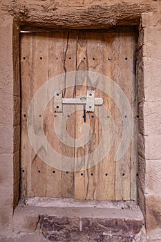 Wooden door on a building in old town Al-Ula photo