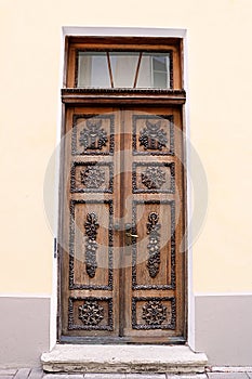 Wooden door of the building in Tallinn, Estonia