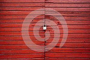 Wooden door closed with the padlock