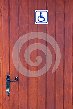 Wooden door of disabled toilet