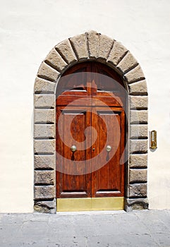 Arched elegant door in Florence, Italy photo