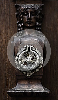 Wooden door with great metal handle, full of details