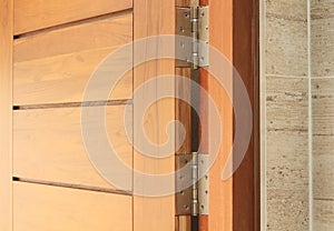 Wooden door with hinge