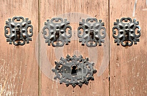 Wooden door with iron lock in Caceres, Spain