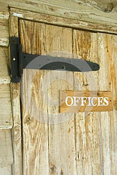 Wooden door with offices signage