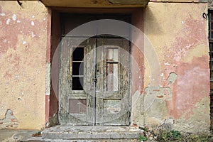 Wooden door in old abandoned house
