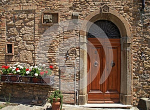 Wooden door in old Italian house, Tuscany, Italy