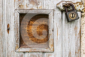 Wooden door with padlock and frame