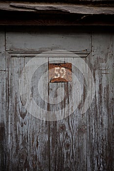 Wooden Door with Red Metal Number