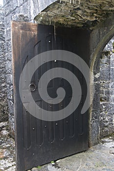 Wooden door stands open, Aughnanure Castle, near Oughterard