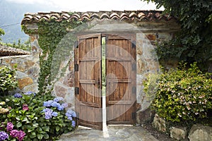 Wooden door and stone lock. Cozy country house in the middle of nowhere