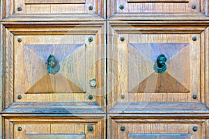 Wooden door with two knobs