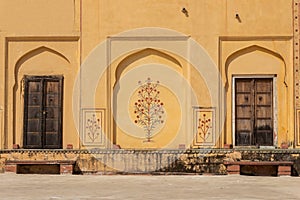 Wooden doors and decorated walls of Amber Fort, Jaipur, Rajasthan