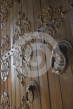 Wooden doors with metalwork.