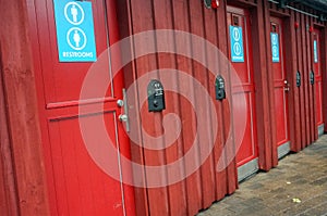 Wooden doors with toilet signs