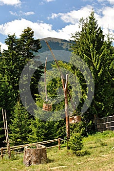 Wooden draw well with bucket