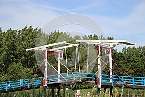 The wooden drawbridge called Pekhuisbrug over the river Rotte between Oud Verlaat and Bleiswijk in the Netherlands