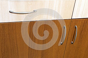 Wooden drawers and cabinet doors with pull-handles