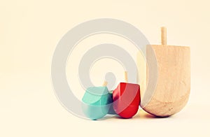 Wooden dreidels for hanukkah (spining top) . filtered image