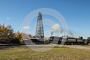 Wooden Drilling Rig with a passing steamtrain