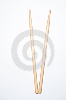 Wooden drum sticks on white background.