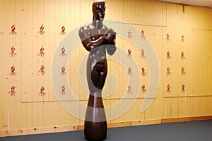 wooden dummy with marks from wing chun training in a gym