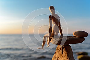 Wooden dummy on stone