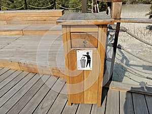 Wooden dust bin or recycling bin in a park, Abudhabi,UAE.