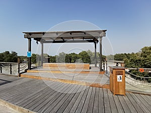 Wooden dust bin or recycling bin and resting area in a park, Abudhabi,UAE.