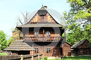 Wooden dwell with timbered city house photo